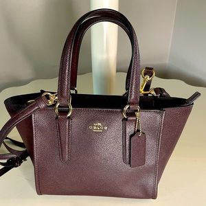 Coach crossbody with removable crossbody straps.